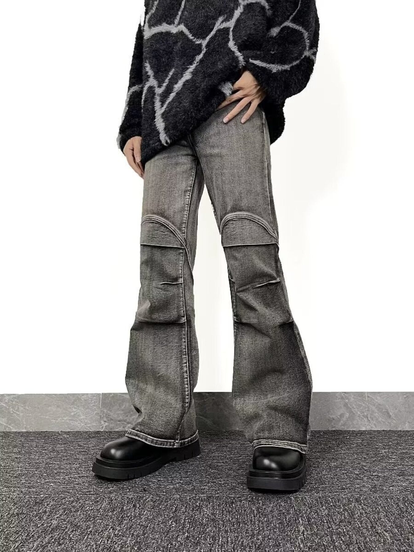 Men's relaxed fit washed flare jeans in grey denim with distressed knee details.