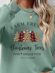 Crewneck sweatshirt in Sage green with Christmas trees graphic, buffalo plaid and leopard print detail.