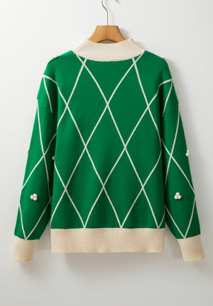 Dark green argyle knit sweater with mock neck and pearl embellishments.