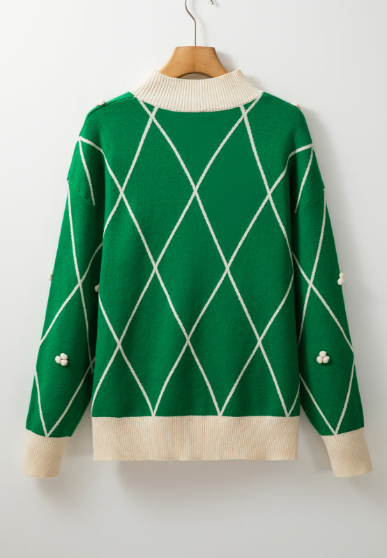 Dark green argyle knit sweater with mock neck and pearl embellishments.