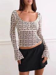 Chic sheer polka dot maternity shirt with square neckline and flare sleeves.
