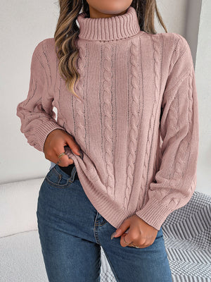 Dusty pink cable knit turtleneck sweater with voluminous sleeves