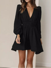 Black V-neck mini dress with puff sleeves and smocked waist
