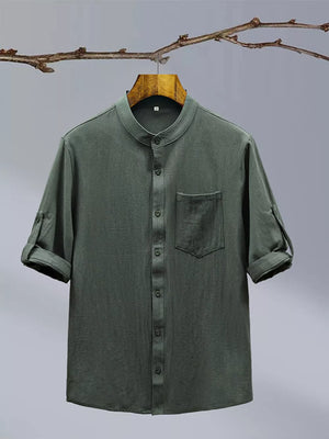 Dark green cotton blend short sleeve shirt with mandarin collar and chest pocket.