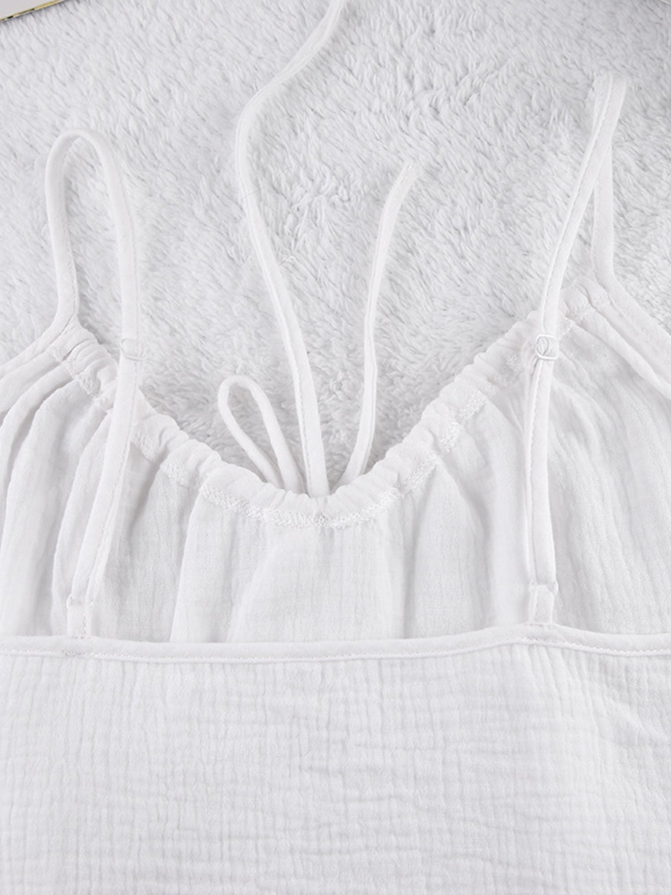 White cotton cami pajama top with adjustable straps and drawstring detail