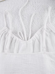 White cotton cami pajama top with adjustable straps and drawstring detail