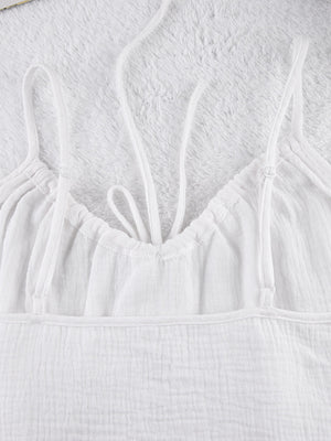 White cotton cami pajama top with adjustable straps and drawstring detail