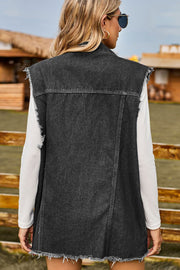 Dark distressed denim sleeveless jacket with frayed hem and armholes.