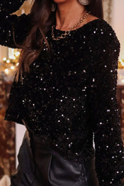 Black sequin backless blouse with long sleeves and a crew neck.