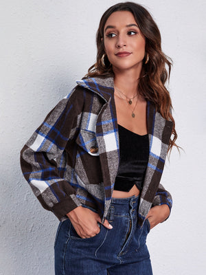Chic plaid jacket in dark blue with button closure and chest pocket detail.