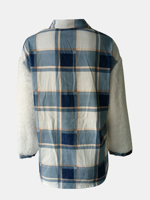 Plaid shacket with sherpa sleeves in Dusty Blue and white plaid pattern.