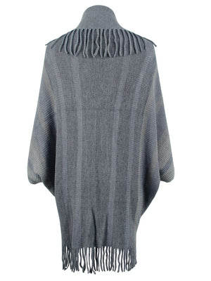 Charcoal knit capelet with fringe detail and striped pattern.