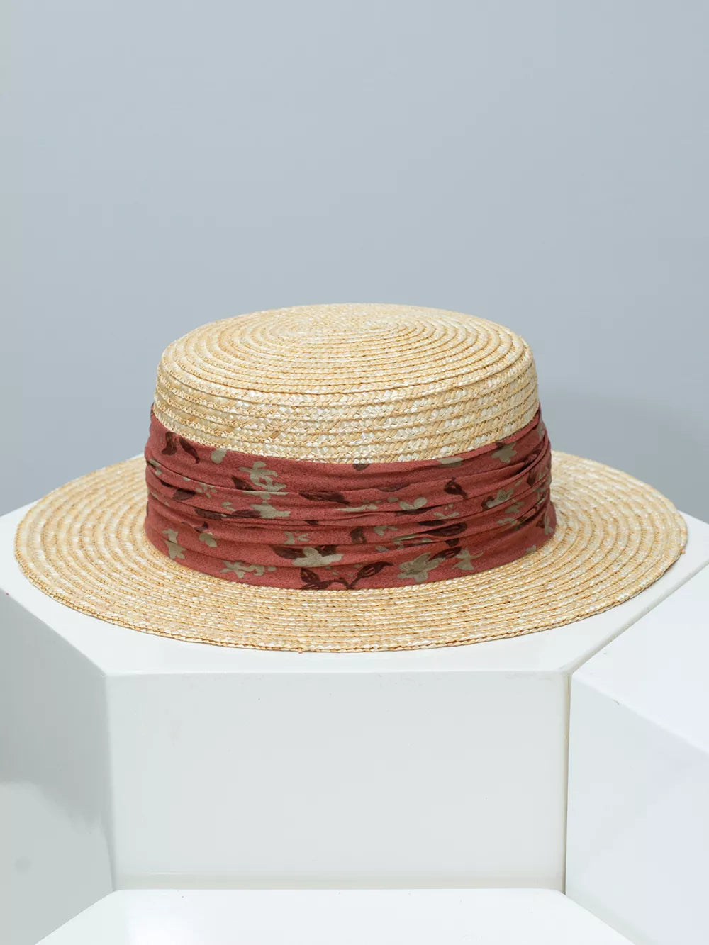 Wheat straw boater hat with ruched floral ribbon band in rust
