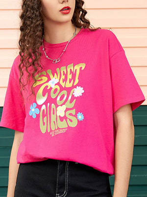 Pink graphic t-shirt with "Sweet Cool Girls" text and floral accents.