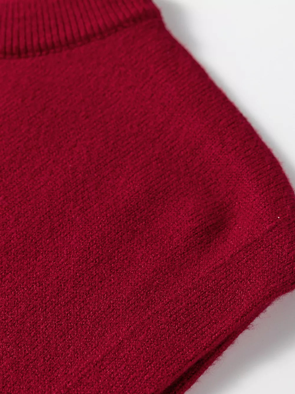 Burgundy crew neck cap sleeve sweater with ribbed neckline detail.