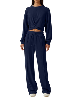 Dark blue cropped twist-front top and relaxed fit drawstring pants set