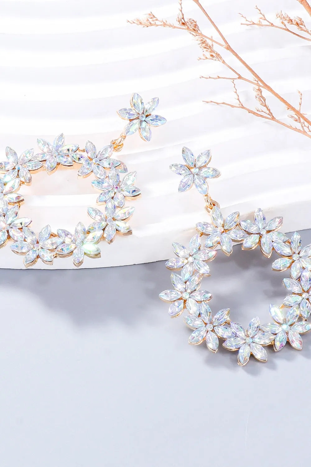 Floral halo drop earrings with clear crystal flowers and gold alloy detail