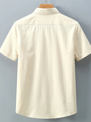 Men's short-sleeve cotton shirt in apricot with a classic collar and buttoned front.