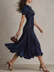 Navy striped ruched midi dress with a pleated skirt and short sleeves.