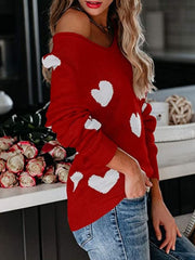 Deep Red heart motif raglan knit sweater with a cold shoulder neckline.