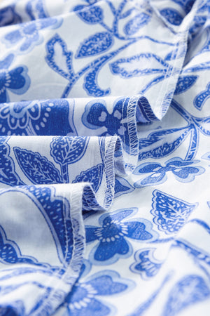 Blue floral print blouse with ruffled sleeve detail