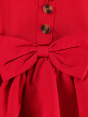Red baby top with bow detail and button front, part of a set with denim shorts.