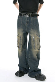 Dark distressed wide-leg cargo jeans with zippered pockets and a black belt.