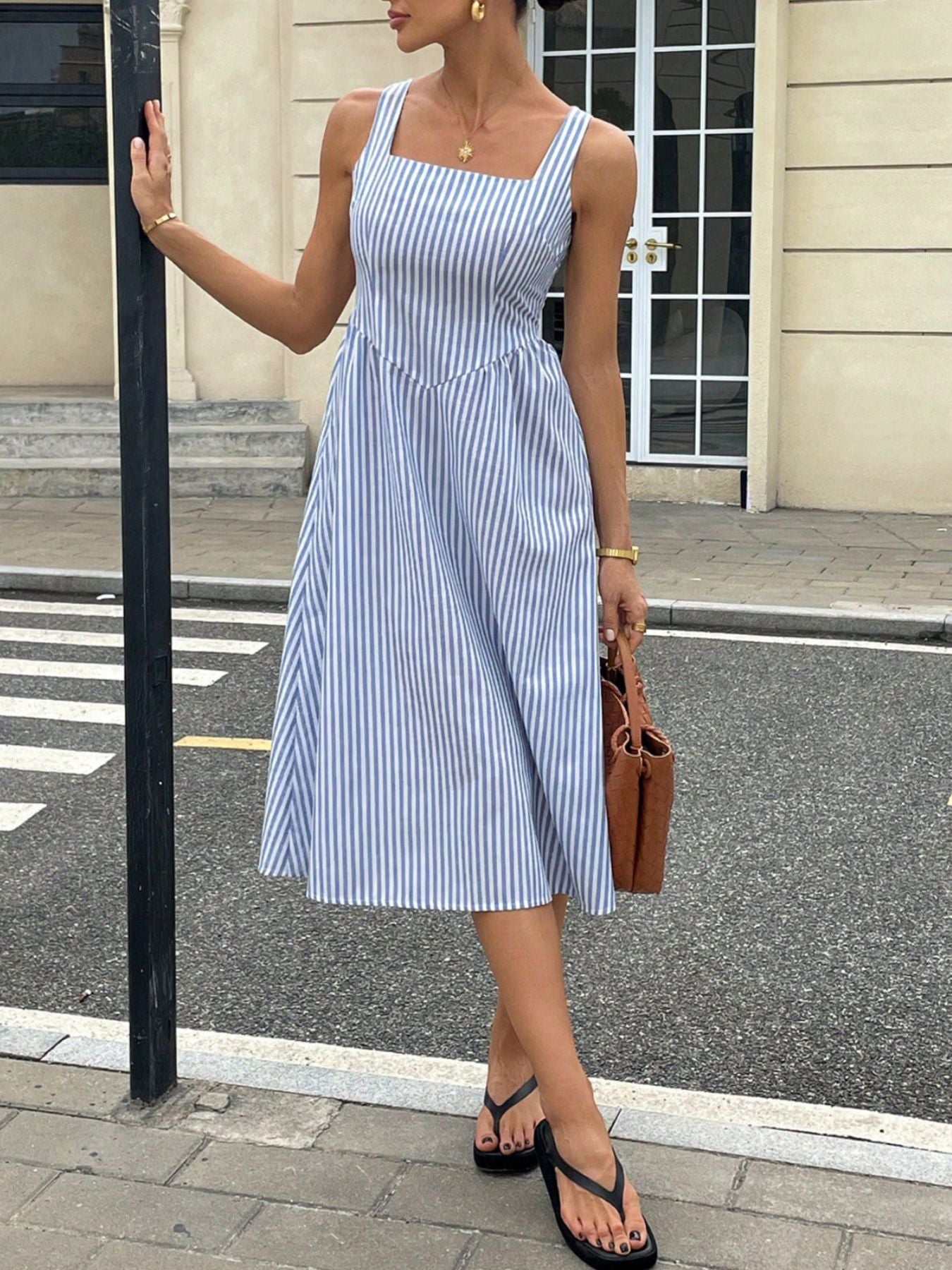 Blue and white striped midi dress with square neckline and a-line skirt.