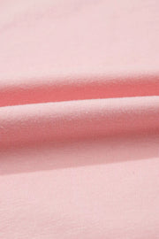 Pink cotton maternity t-shirt with subtle ribbing and soft folds.