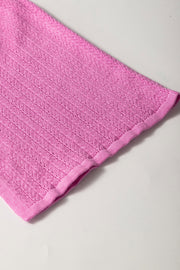 Red-violet knit blouse with square neckline and flutter sleeves, 100% viscose.