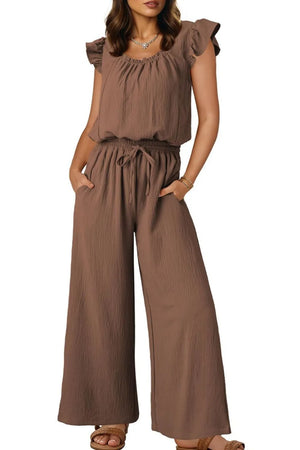 Taupe textured drawstring palazzo jumpsuit with ruffle sleeves and wide legs.