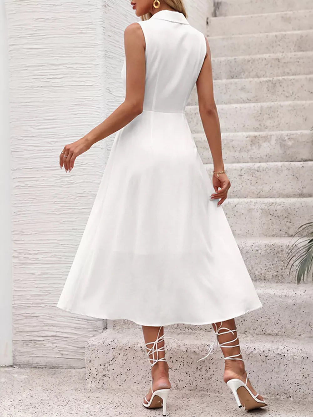 White midi shirt dress, A-line, button front, sleeveless, polyester, with bow tie detail.