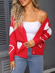 Red knit cardigan with white heart pattern, button up, long sleeves.