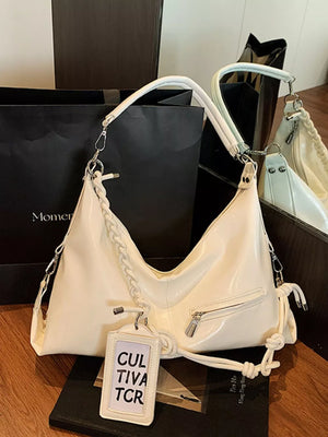White braided strap shoulder bag with zip pocket and tag detail