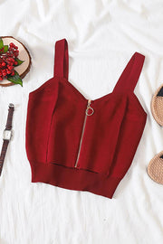 Burgundy ribbed knit crop top with exposed zip detail and square neckline.