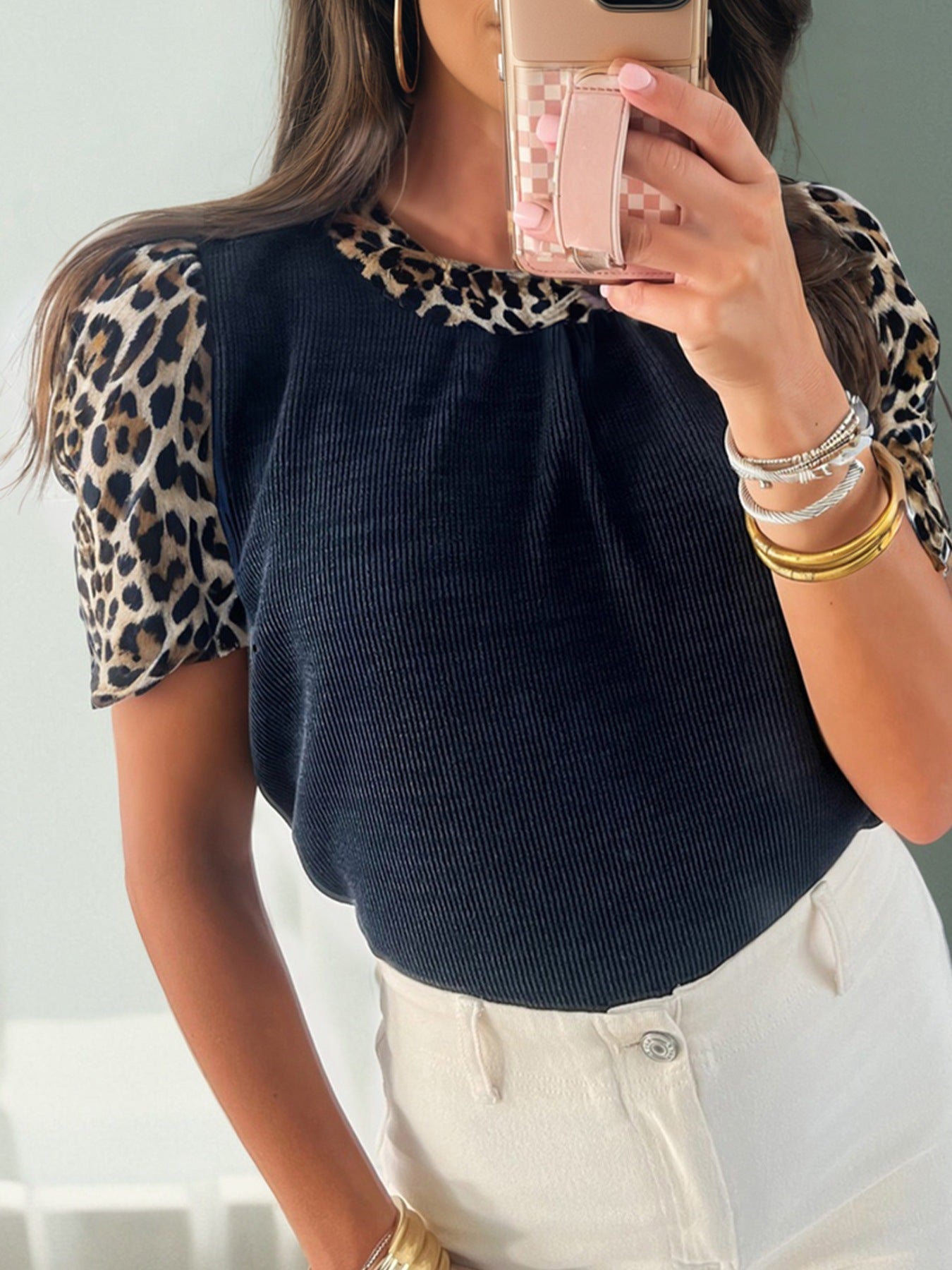 Leopard print short sleeve t-shirt with dark ribbed body and crew neck.