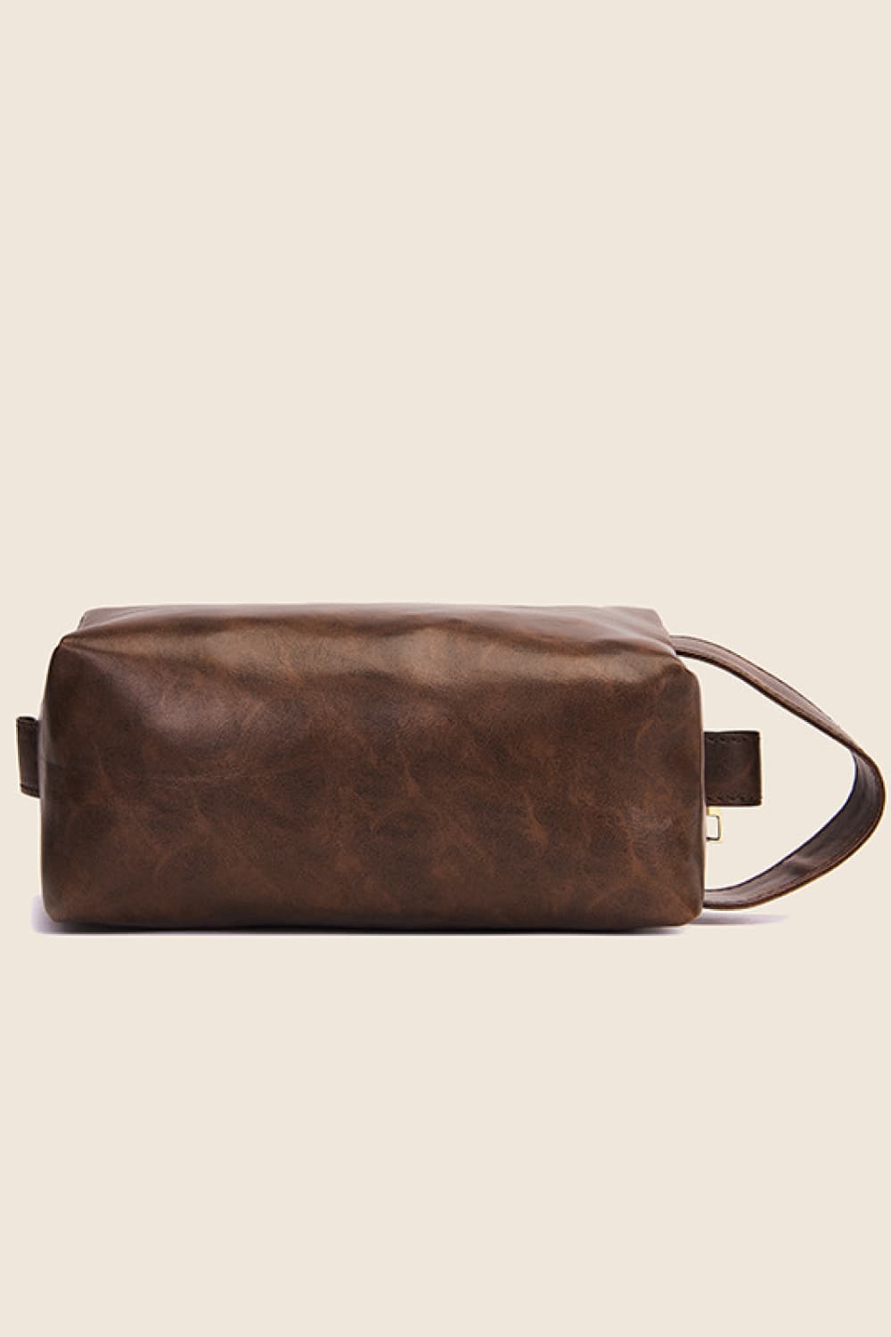 Textured faux leather travel case in caramel with a carry handle.