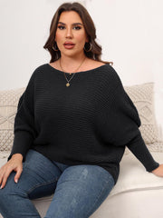 Off-shoulder black ribbed knit sweater with batwing sleeves and a boat neckline.