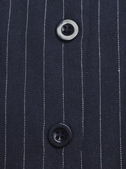 Chic striped halter jumpsuit in navy with decorative buttons.
