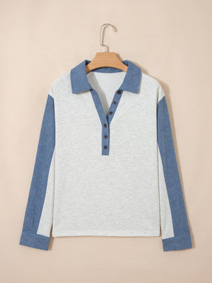 Heathered casual long sleeve top with button detail and color-blocked blue sleeves.