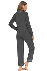 Black polka dot pajama set with white trim and collar
