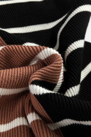 Colorblock ribbed mini dress in black, beige, and white stripes with a zip neck detail.
