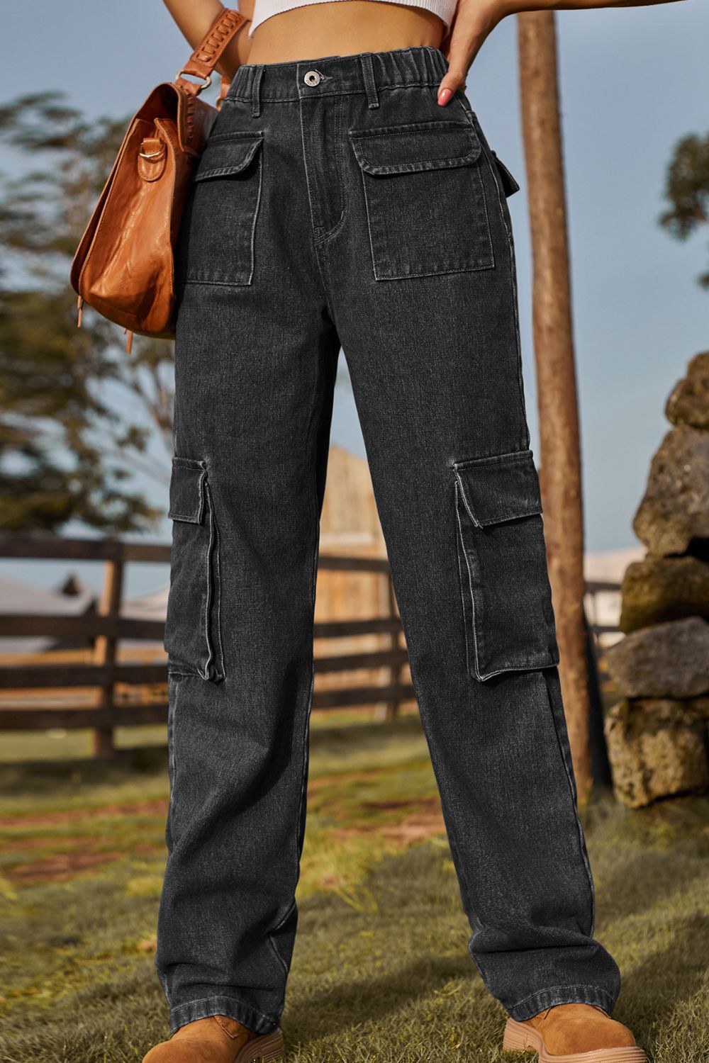 Black denim cargo pants with multiple utility pockets and a relaxed fit.