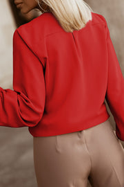 Deep Red blouse with pleated yoke and button detail, long sleeves.