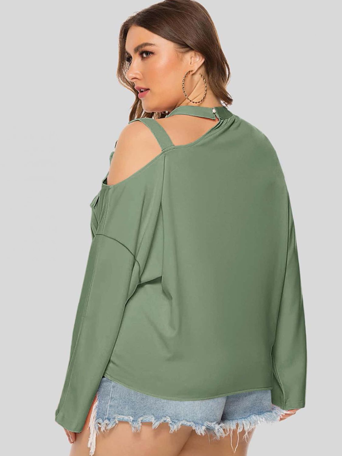 Light Green cold shoulder blouse with cutout detail and buckle straps.