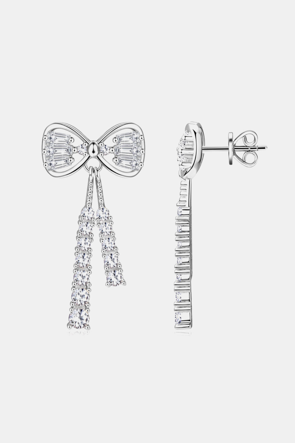 Silver baguette bow drop earrings with cascading crystal tassels.