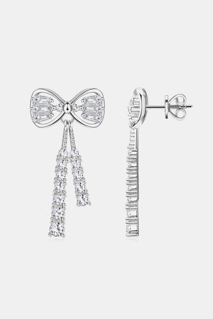 Silver baguette bow drop earrings with cascading crystal tassels.