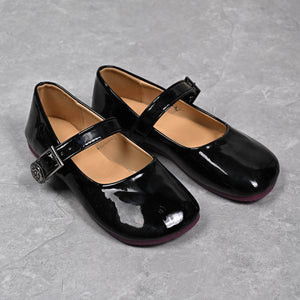 Black patent buckle strap Mary Jane loafers with a classic square toe.