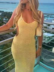 Pastel yellow knit midi dress with cutout sides and a V-neckline
