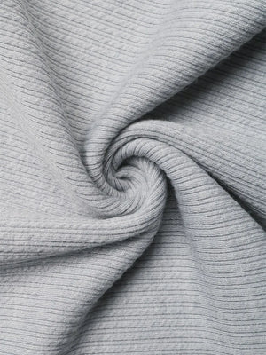 Gray ribbed fabric detail of a cami top with asymmetric bow strap